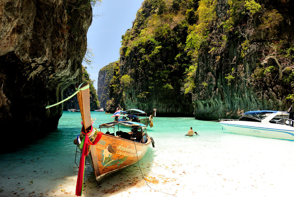 A turquoise lagoon with a longtail boat near Phuket