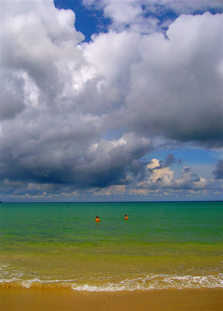Dramatic monsoon-season clouds over a green Phuket sea