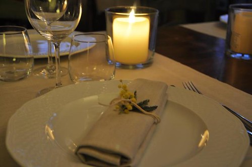 Candlelit place setting at a restaurant table