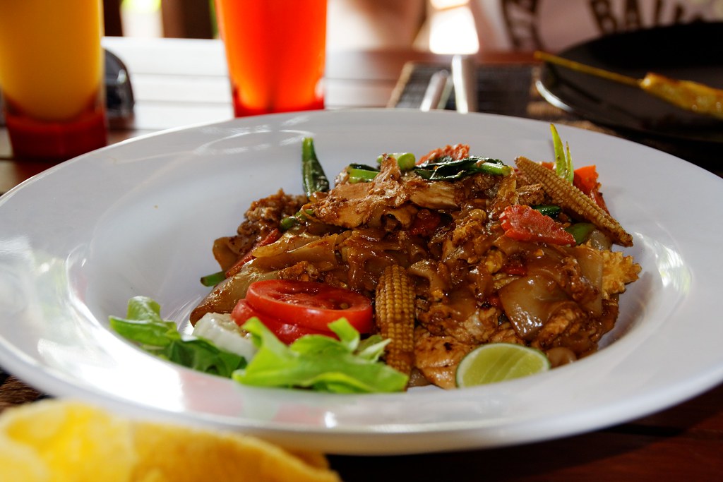 A plate of freshly cooked pad thai, a classic dish on Phuket dinner menus