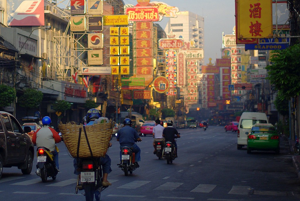 Everyday scooter and car traffic on a busy Phuket street