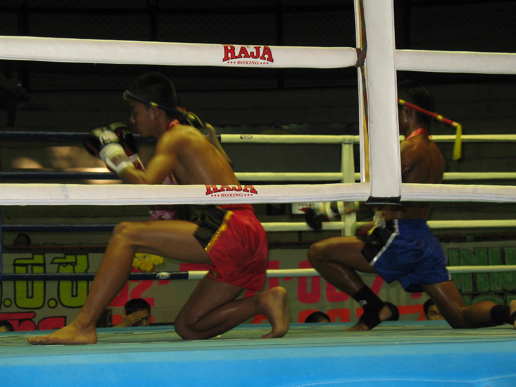 Fighters performing the wai kru ram muay ritual before a Muay Thai bout