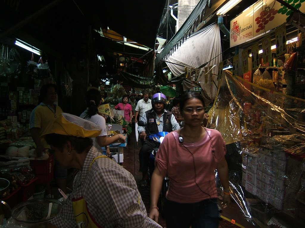 Busy food stalls and shoppers at a Thai night market