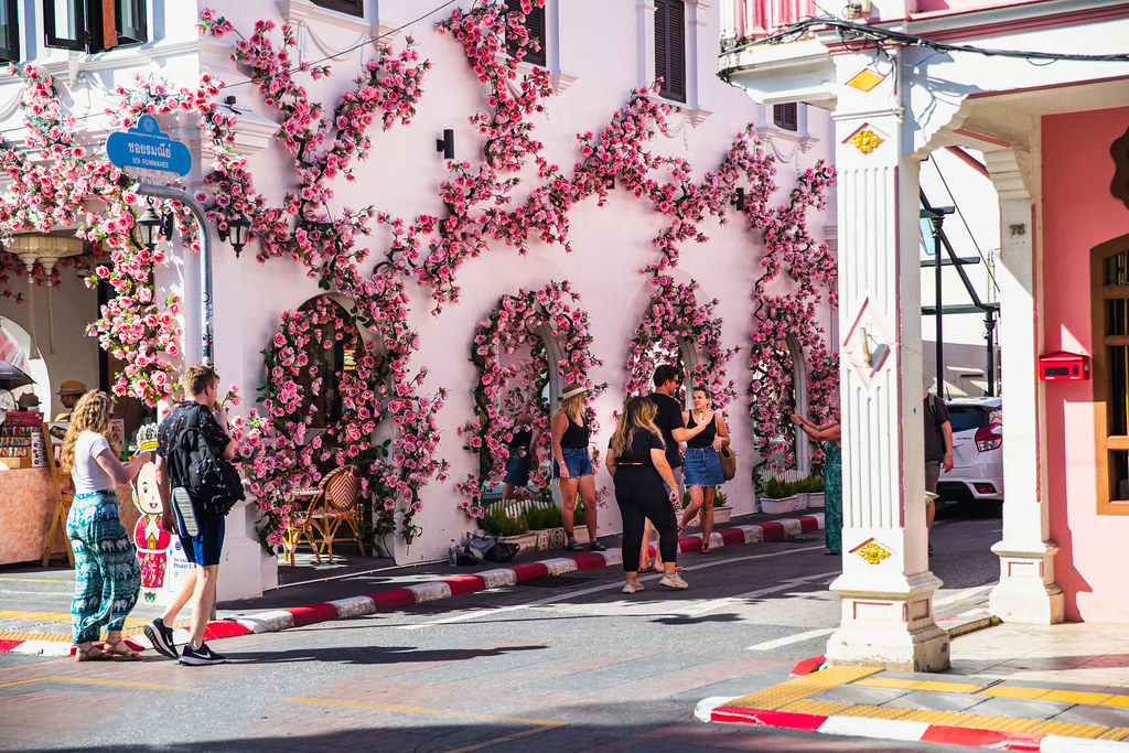Soi Romanee in Phuket old town, a pastel Sino-Portuguese lane lined with cafes and flower-covered walls